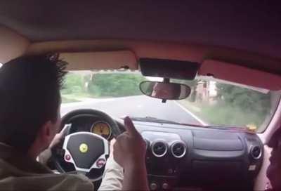 Man almost causes a fatal accident during a Ferrari test drive