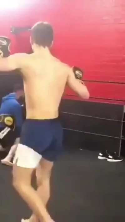 Guy spin kicks trainer