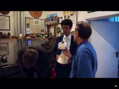 Chris O’Dowd pretending to drop a snow globe