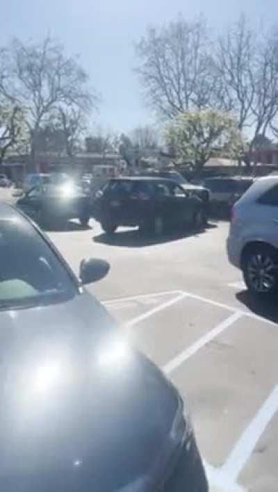Enraged driver slams into vehicles almost hitting surrounding people, bystanders yell to stop