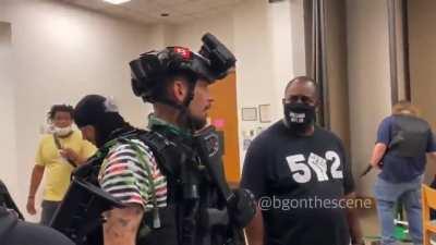 Armed Protestors take refuge in a church in Louisville.