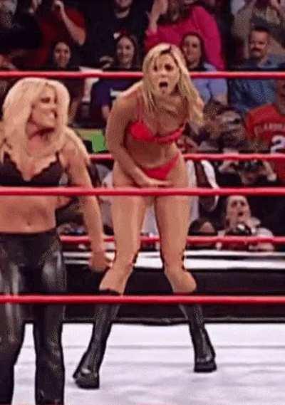 Stacy Keibler tries to cover her pink thong covered cooch