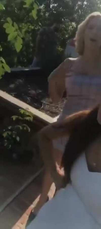 In a blue dress almost falling over