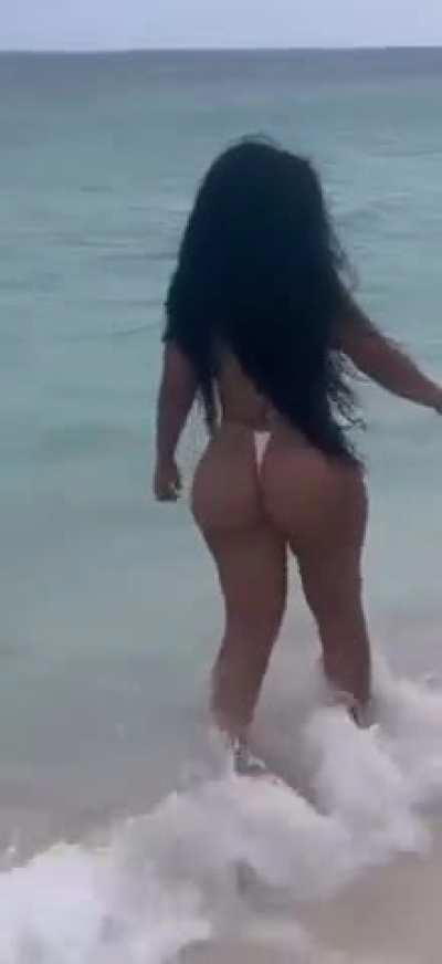 Ari walking on the beach in too little thong 