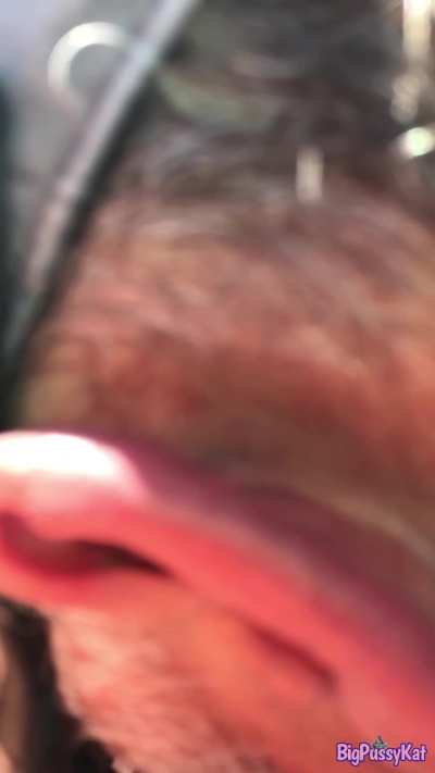 My wife Kathy peeing outdoors at the pool.