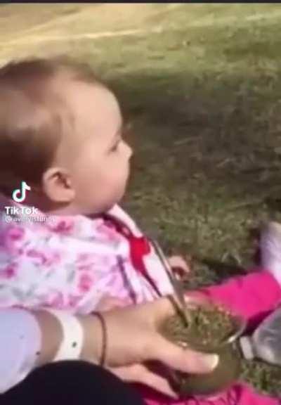 Baby tries herbal tea for the first time