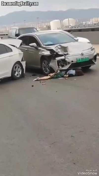 Woman hit by car while unloading trunk at airport.