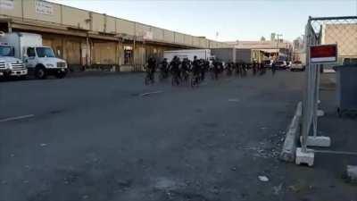 Seattle Police Play Battle Music as they Surround Rioters.