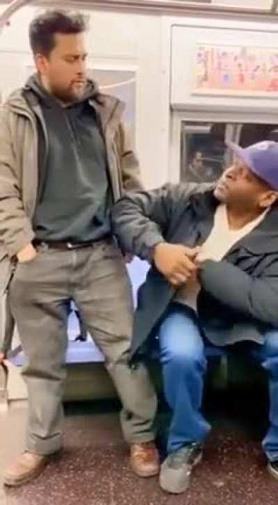 Man tries to intimidate another man with a preschool scissor