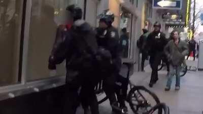 SPD Riding a bike into a protester then arresting him