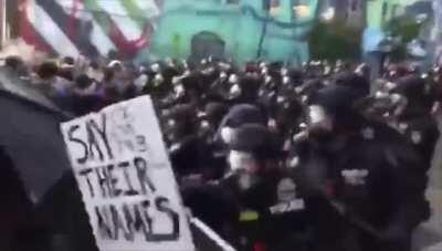 THE MOMENT SEATTLE POLICE INSTIGATE A RIOT OVER A PINK UMBRELLA (SERIOUSLY). PROTEST WAS 1000% PEACEFUL BEFORE. SHARE THIS! POLICE ARE ALREADY LYING ABOUT WHAT HAPPENED.