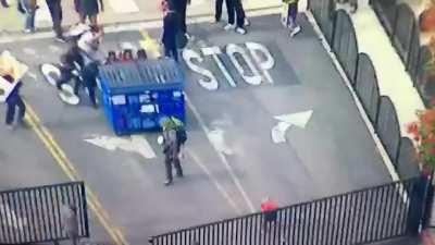 Rioter gets hit by dumpster by other rioters
