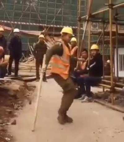 Construction worker shows off his moves during launch break