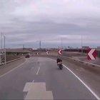 Biker falls off bridge