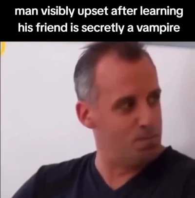 man visibly upset after learning his friend is secretly a vampire