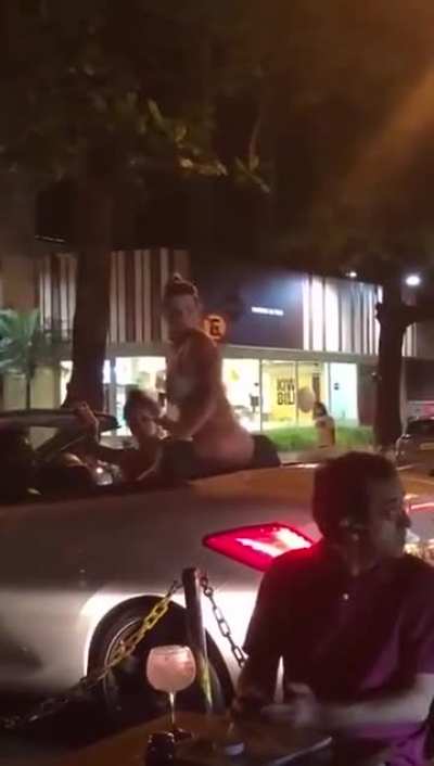 Throwing trash at a woman in a bikini