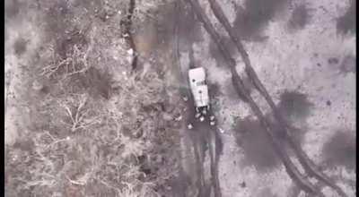 video showing a drone from the Ukrainian 59th motorized brigade showing them hit a group of russian soldiers with a drone drop F-1 grenade. [music from source]