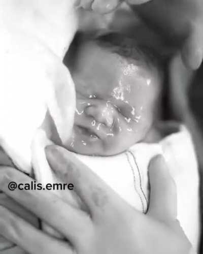 New born comes out of an amniotic sac