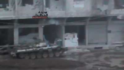 Opposition fighters light up a Syrian Army checkpoint & tank with HMGs from close range - al-Hirak, Daraa - 2/6/2013