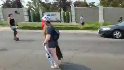 BLM protestor mounts cop car and gets wiped out in Sacramento. Just happened, clipped by me.