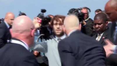 Comedian gatecrashes Trump golf course event with swastika golf balls