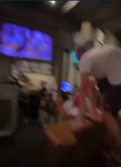 Drunk Tennessee fan tries to rip mounted TV off of bar wall after Football win.