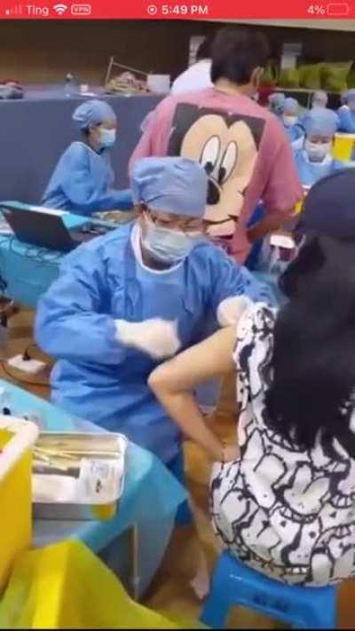 Having your arm in an incorrect position while being vaccinated