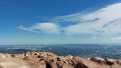 Moving clouds at Montserrat, Barcelona, Spain, looking towards the city's TV tower and Basílica del Sagrat Cor de Jesús at Tibidabo