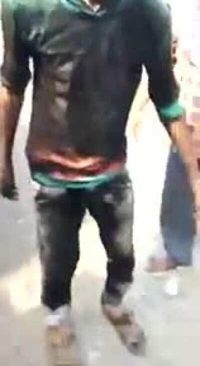 Guy blocks the exhaust pipe of a big truck.