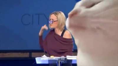 Trump voodoo high priestess chanting in tongues. Someone put a lit techno cat over it. Makes it much better.