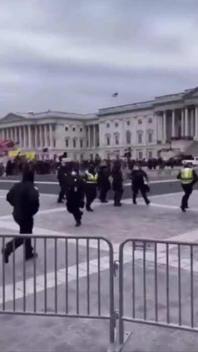 WELL LOOK AT THIS. Video appears to show a DC Capitol Police Officer waving protesters past barricade at complex Wednesday, January 6, 2021