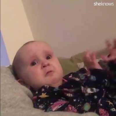 Baby and dad debate bath time