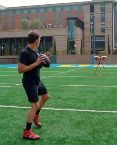 Tom Brady throwing a football with accuracy