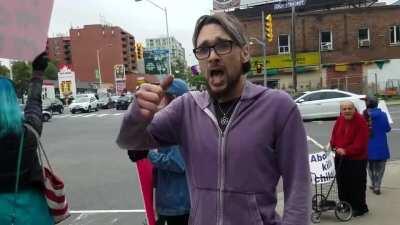 Male pro-choice activist kicks female pro-life activist