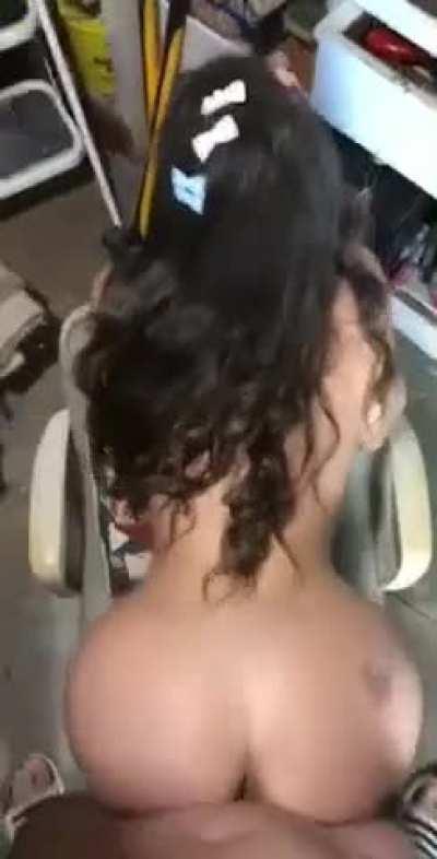 Lana Rhoades bent over a chair