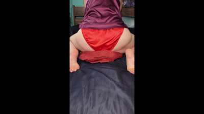 Humping my pillow in my silky red satin panties and my purple satin PJ's :) 