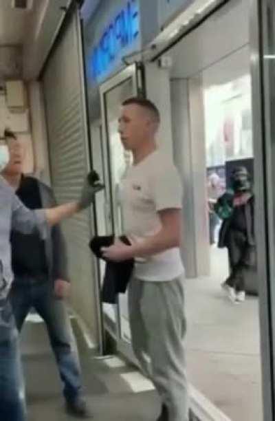 Racist dumbfuck harasses an Asian store. The owner knocks out the racist with one punch.