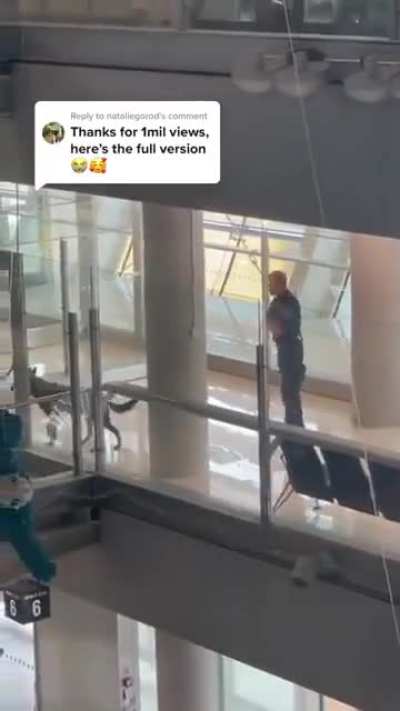 Police officer caught playing hide and seek with his police dog