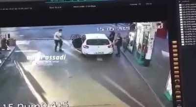 A group of Palestinians are arrested by Israeli police at a petrol pump