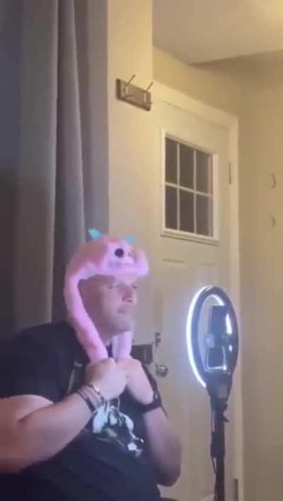 What happens when his friend catches him wearing a hat like this