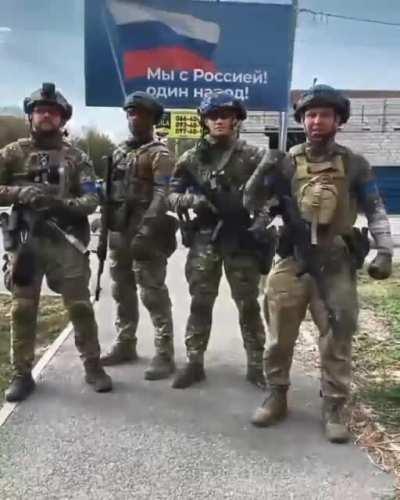 Ukrainian soldiers reply to Russia in front of billboard "We are with Russia.! One nation!": We have never been and will never be one nation, because you are a nation of slaves, and we are a nation of free people! Glory to Ukraine! Glory to the Heroes!