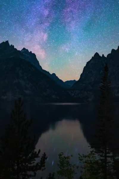 I left my camera running at Jenny Lake (Grand Teton National Park) at night and captured our home galaxy reflecting off the water!