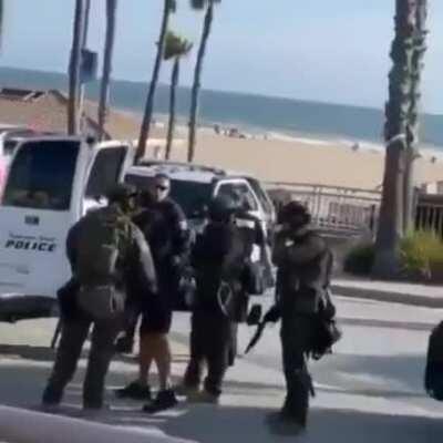 Protester being arrested has a trick up his sleeve and balls of tungsten