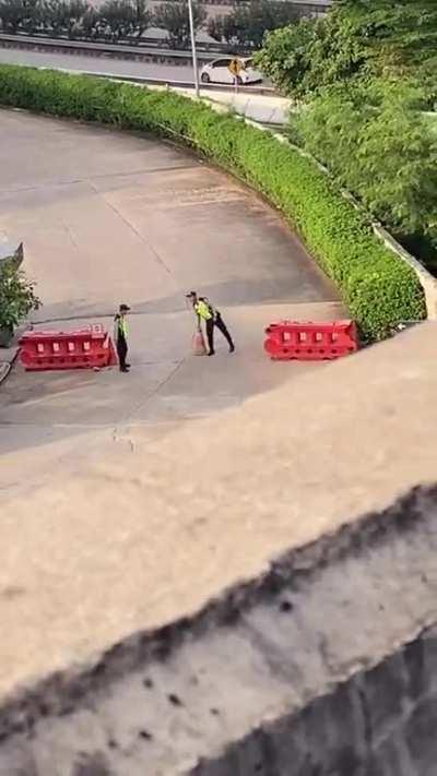 Traffic cone flip challenge with homies on the job