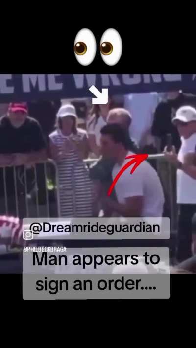 From behind. identified member of Bibi's security team.