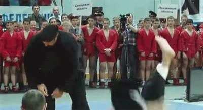 Glorious martial arts instructor Steven Seagal demonstrates how to take an opponent down