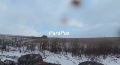 Two Russian soldiers fall in the mud with their ATV. 