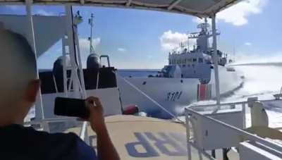 Chinese Coast Guard ship collides with People's Liberation Army Navy ship while chasing Philippine Coast Guard ship.