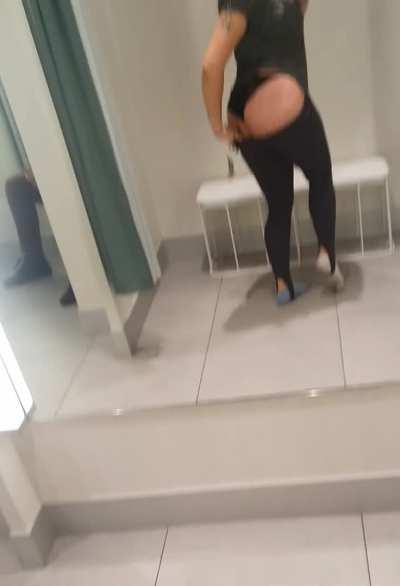 There's a girl sitting next to me in the fitting room, her boyfriend across from her, sometimes security will look in, and I'm showing and recording my butt and being a little horny. [GIF]