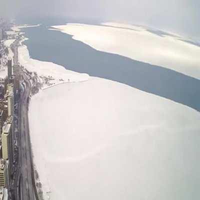 Time-lapse of a giant ice sheet in Lake Michigan breaking off and floating away from February.